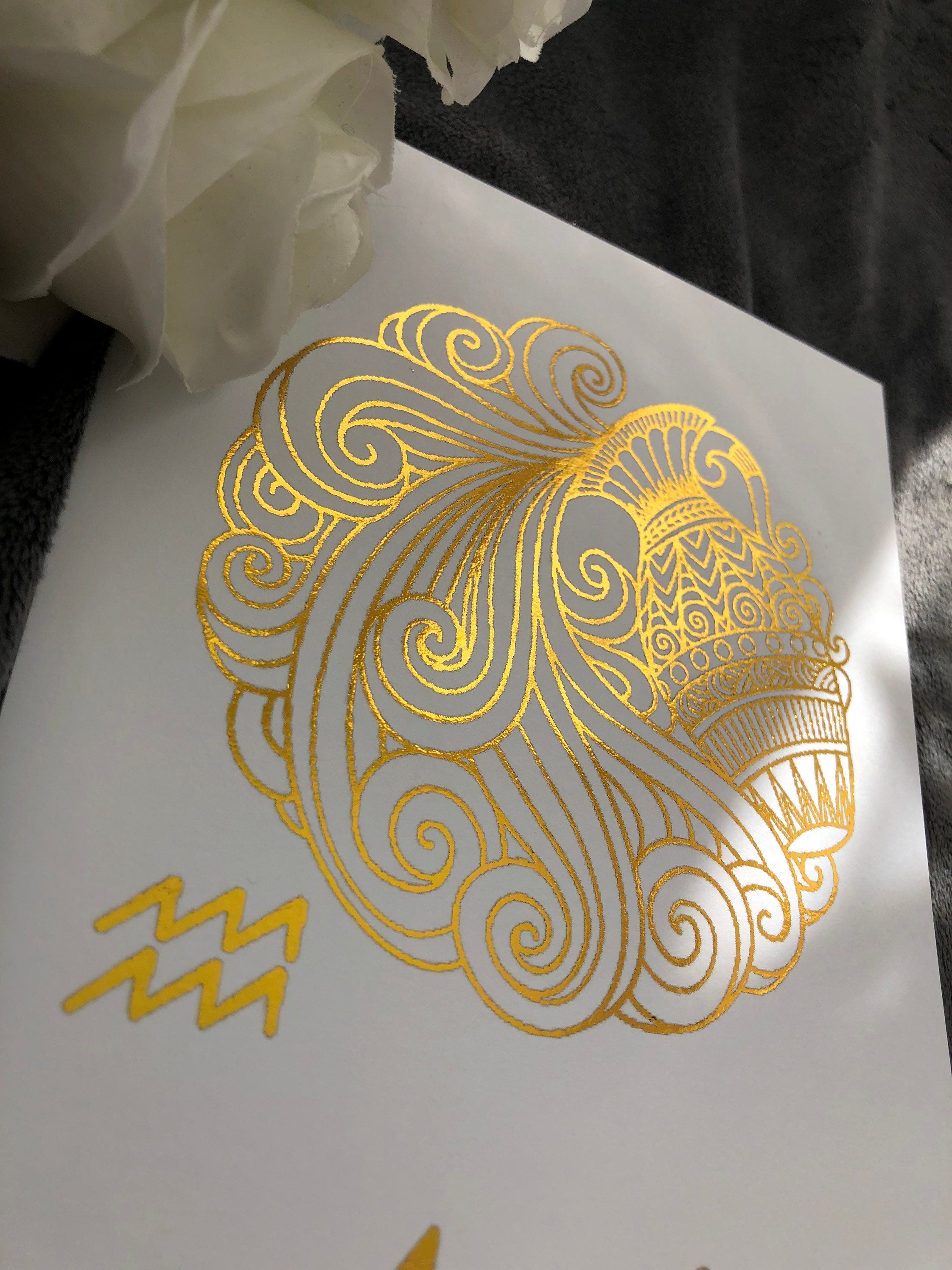 Aquarius Star Sign Foil Print featuring intricate designs and elegant foil detailing, representing the water bearer symbol.