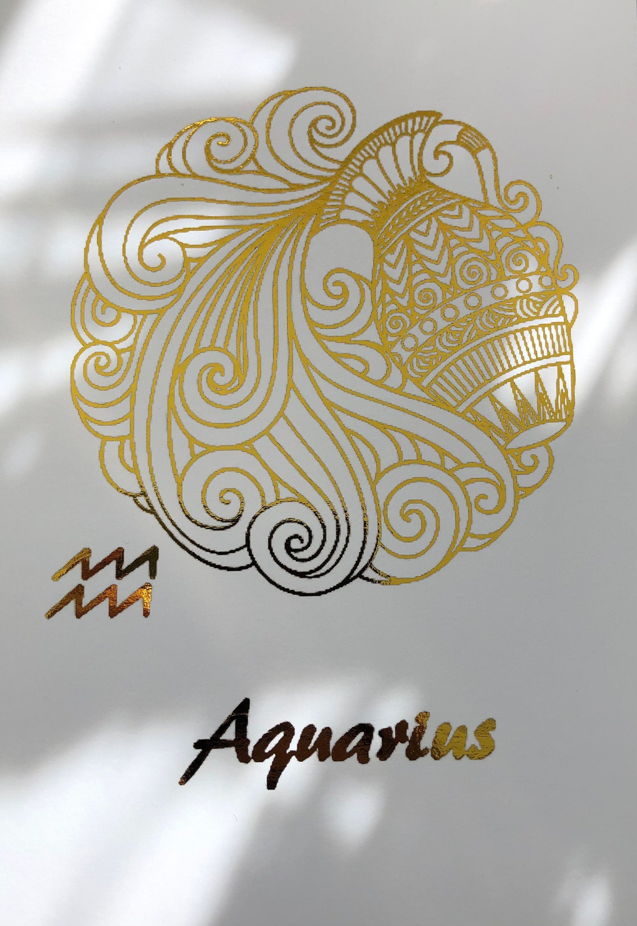 Aquarius Star Sign Foil Print featuring intricate designs and elegant foil detailing, representing the water bearer symbol.