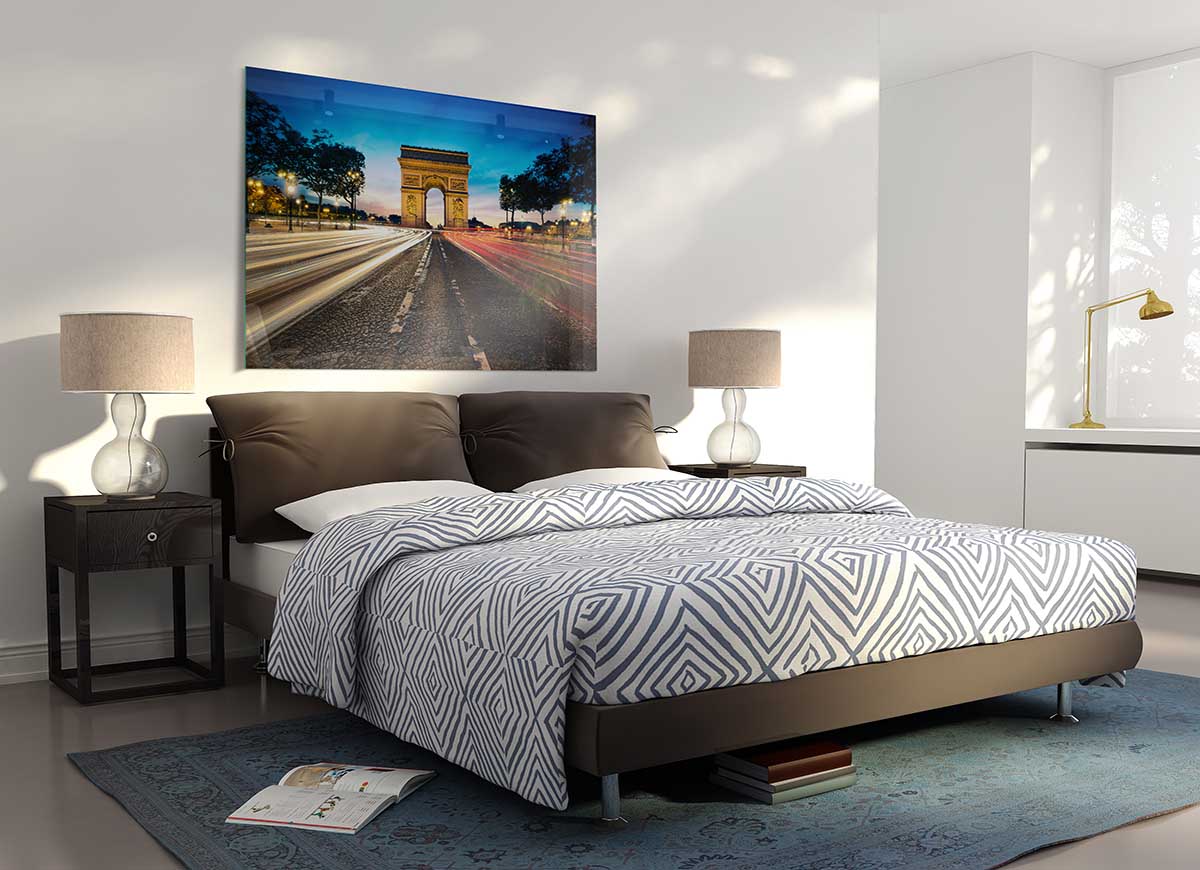 A modern glass print of the Arc De Triomphe, showcasing vibrant colors and intricate details, perfect for home decor.