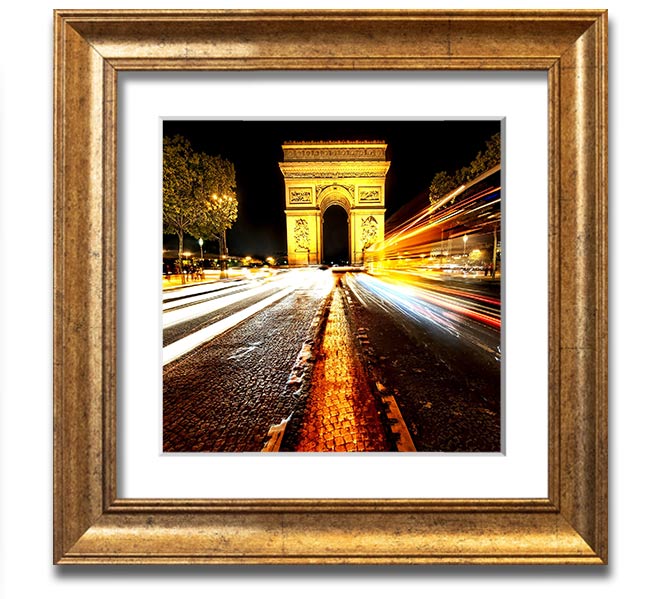 A beautifully framed print of the Arc De Triomphe illuminated at night, showcasing its architectural details and vibrant colors.