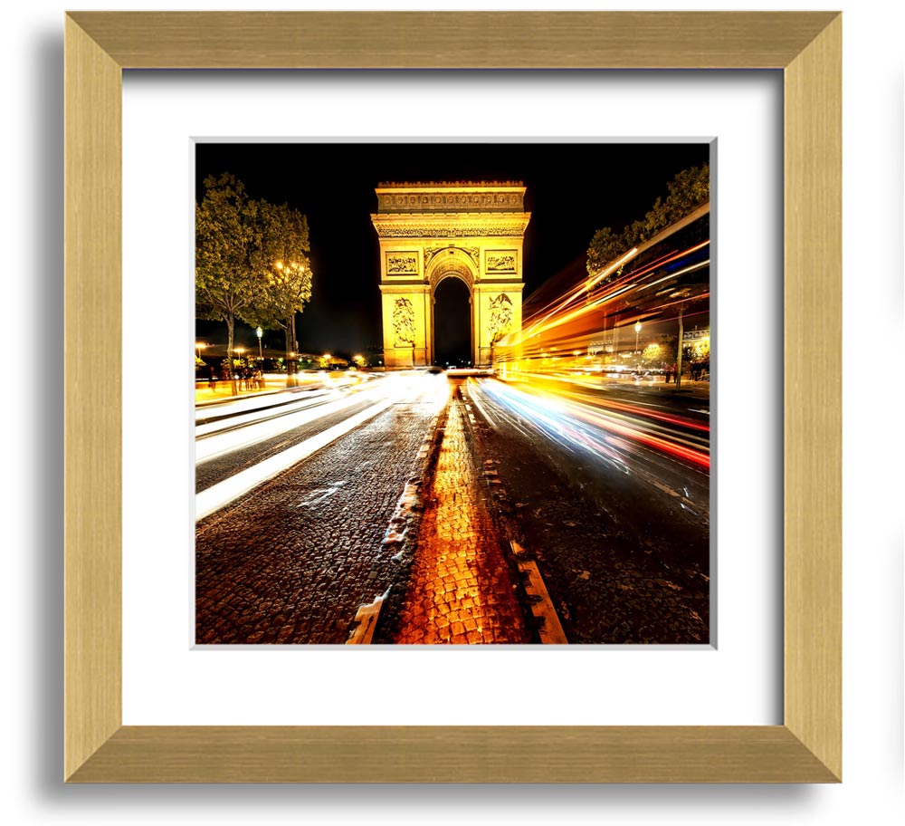 A beautifully framed print of the Arc De Triomphe illuminated at night, showcasing its architectural details and vibrant colors.