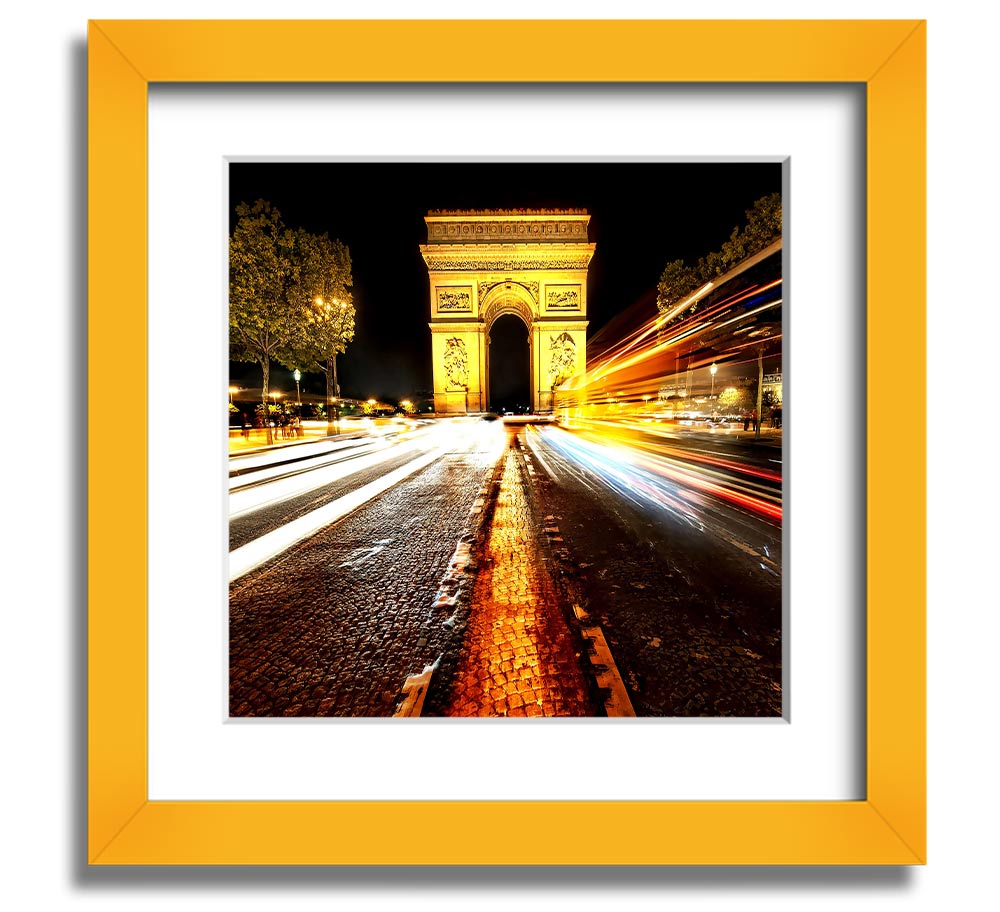 A beautifully framed print of the Arc De Triomphe illuminated at night, showcasing its architectural details and vibrant colors.