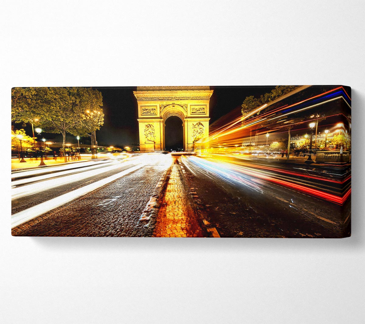 Canvas print of the Arc De Triomphe illuminated at night, showcasing its architectural details and vibrant colors.