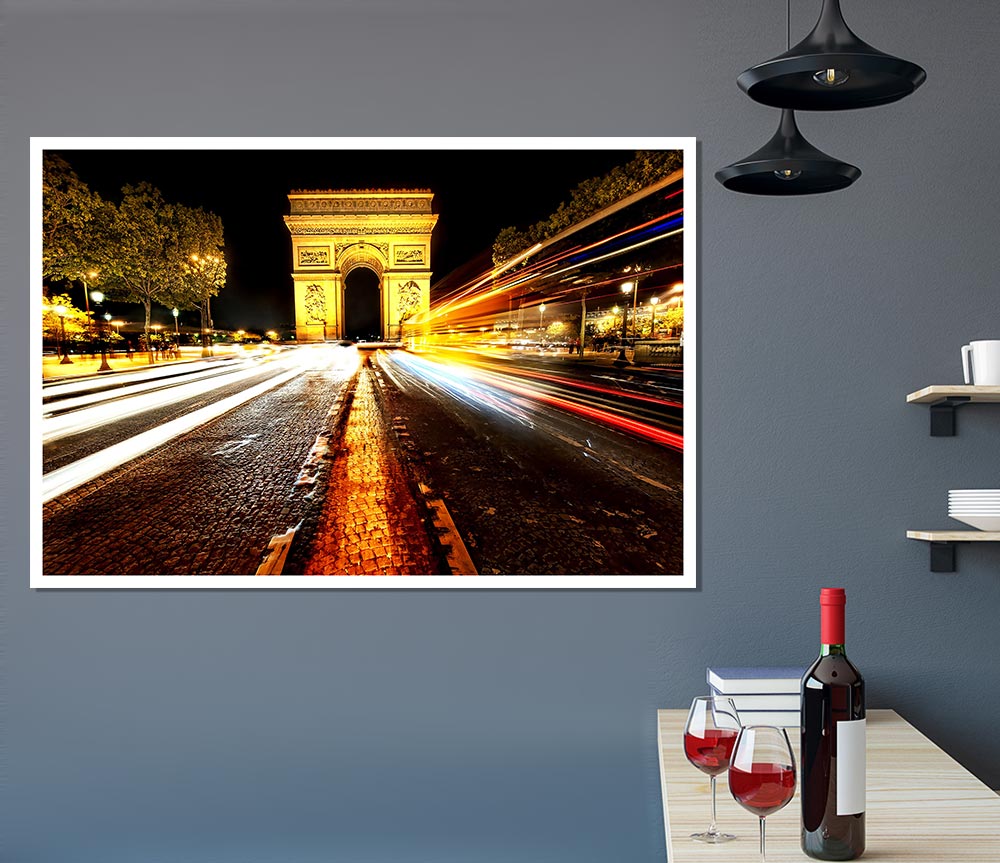 A beautifully illuminated Arc De Triomphe at night, showcasing its grandeur against a dark sky.