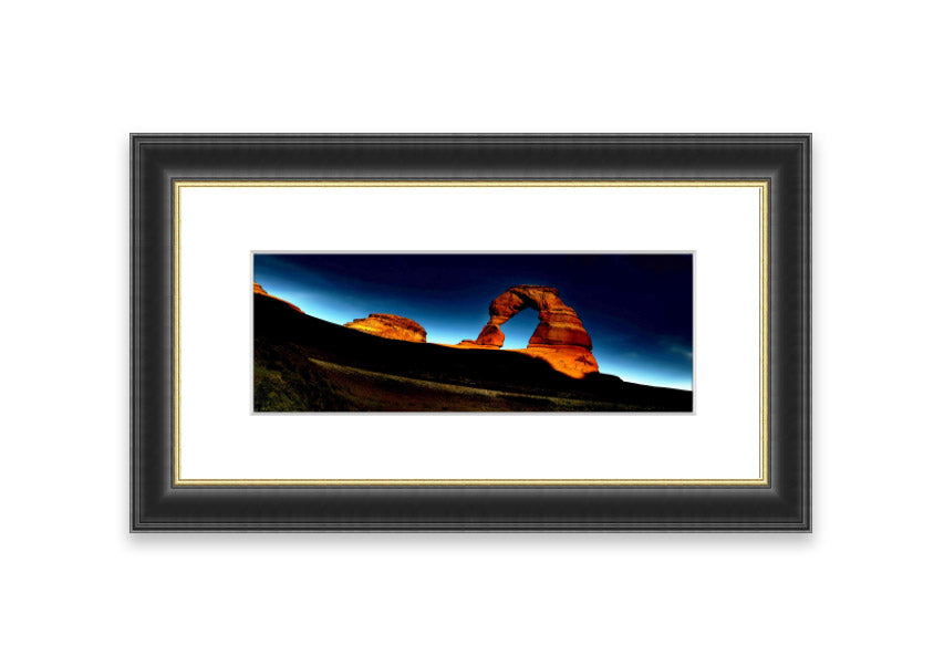 Framed print of Arch Rock Night, showcasing a stunning night sky over Cornwall's iconic rock formation.