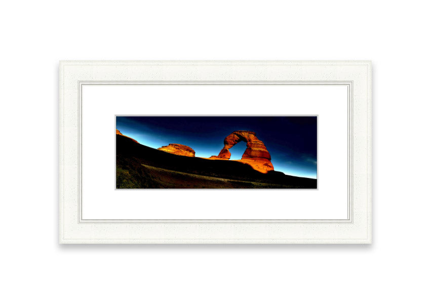 Framed print of Arch Rock Night, showcasing a stunning night sky over Cornwall's iconic rock formation.