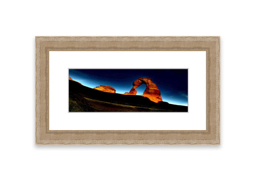 Framed print of Arch Rock Night, showcasing a stunning night sky over Cornwall's iconic rock formation.