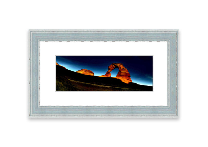 Framed print of Arch Rock Night, showcasing a stunning night sky over Cornwall's iconic rock formation.