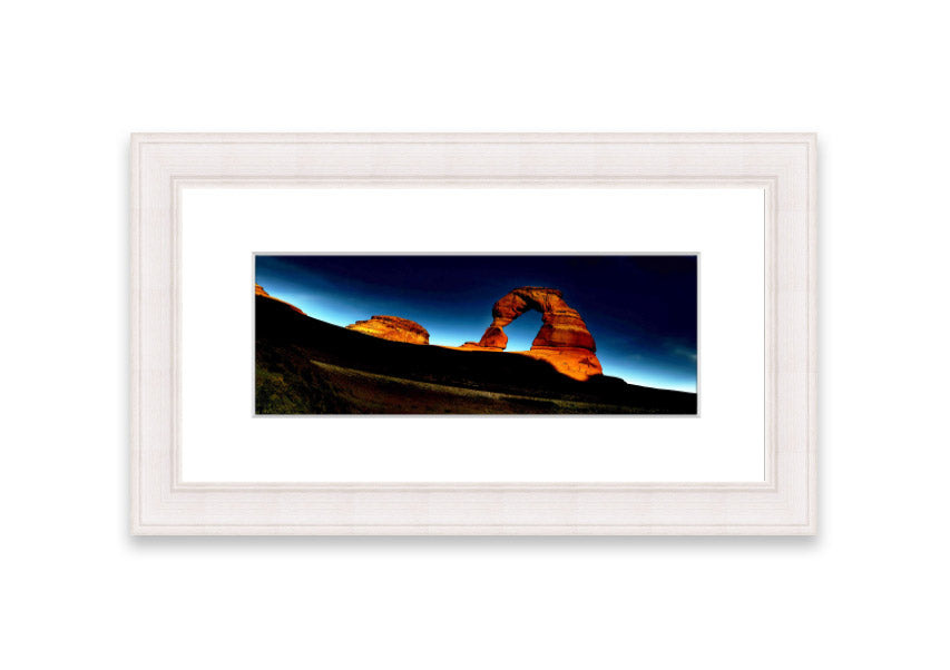 Framed print of Arch Rock Night, showcasing a stunning night sky over Cornwall's iconic rock formation.