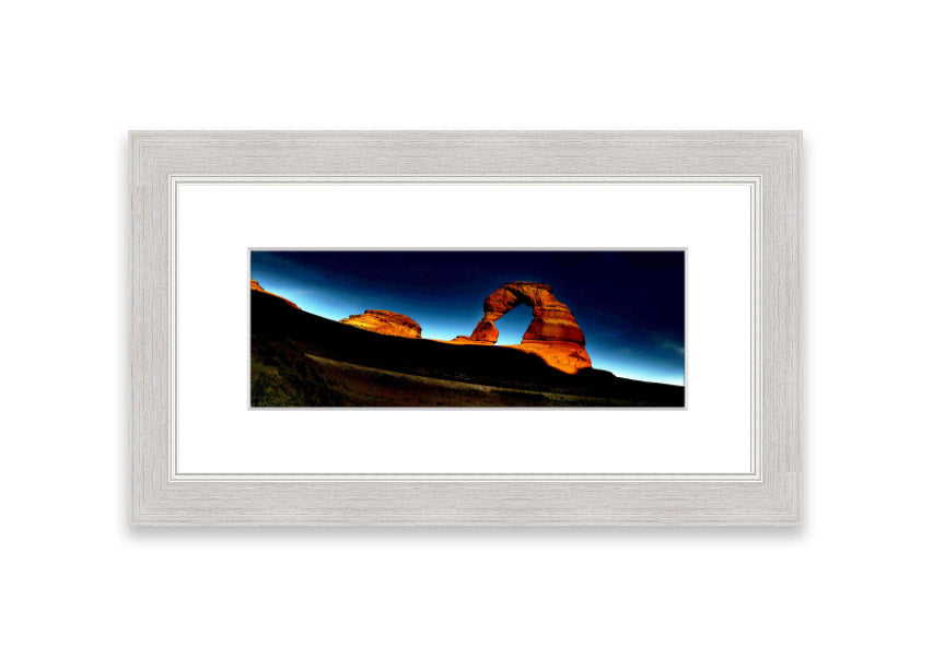 Framed print of Arch Rock Night, showcasing a stunning night sky over Cornwall's iconic rock formation.