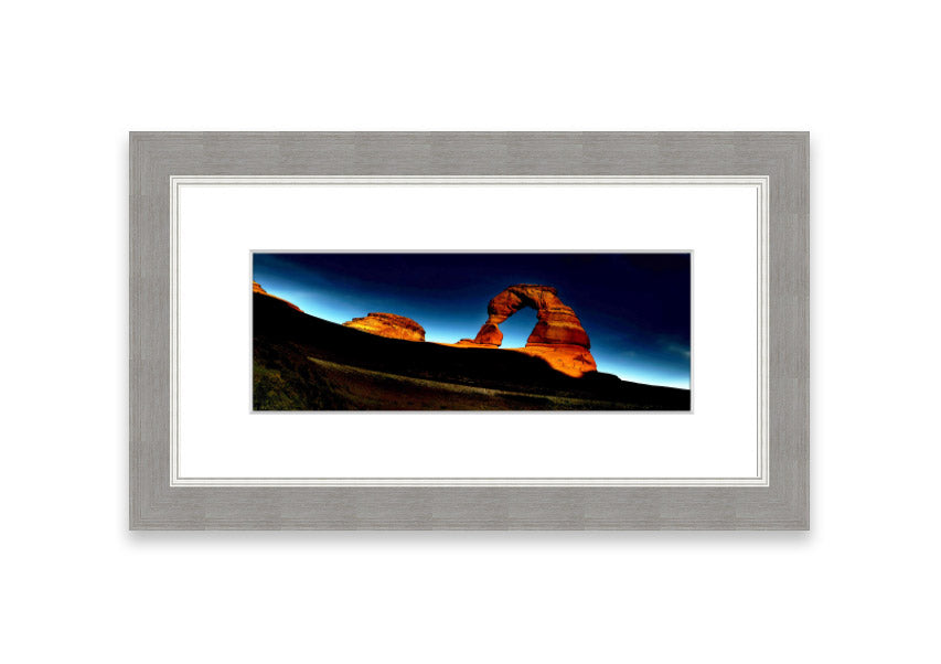 Framed print of Arch Rock Night, showcasing a stunning night sky over Cornwall's iconic rock formation.