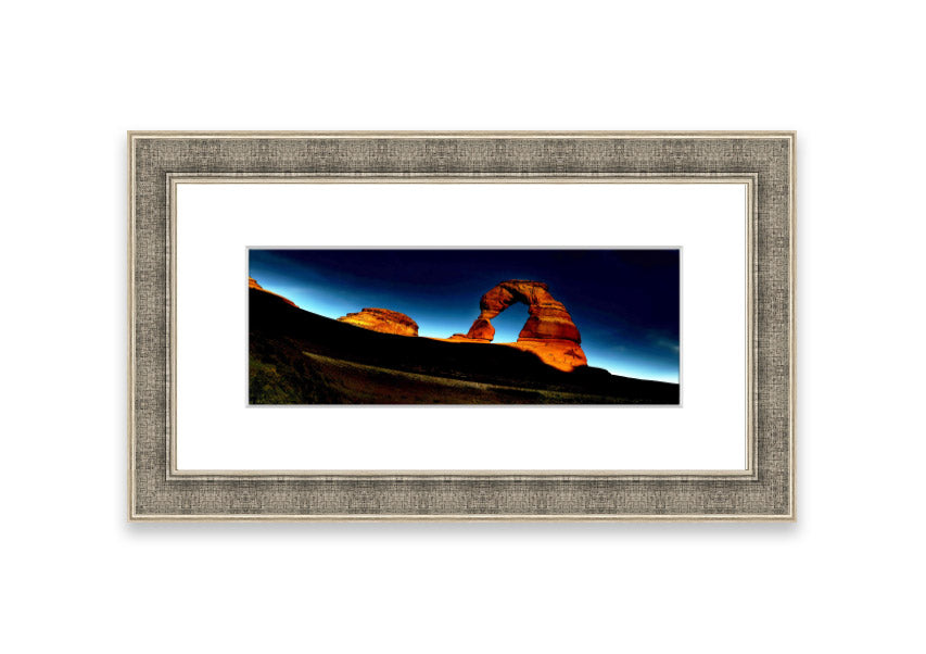 Framed print of Arch Rock Night, showcasing a stunning night sky over Cornwall's iconic rock formation.