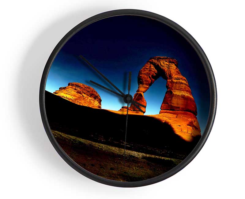 Arch Rock Night clock made of natural bamboo with a round face, available in black, white, and natural frame colors.