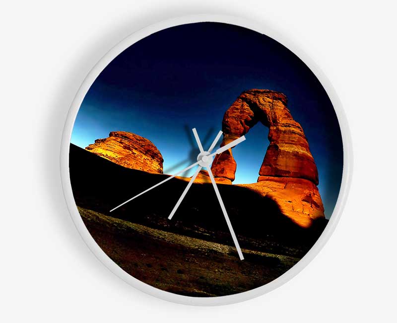 Arch Rock Night clock made of natural bamboo with a round face, available in black, white, and natural frame colors.