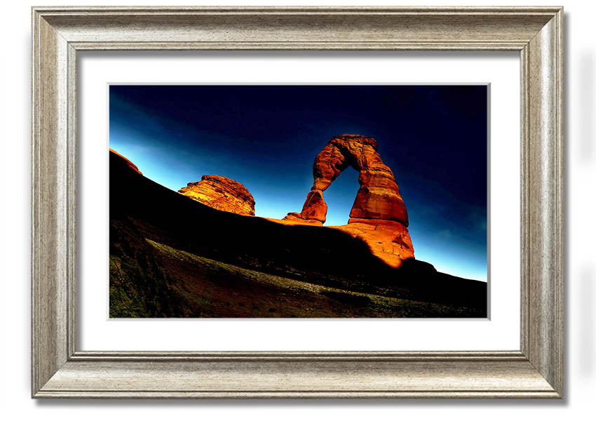 Framed print of Arch Rock at night, showcasing a starry sky and natural beauty, available in various frame colors.