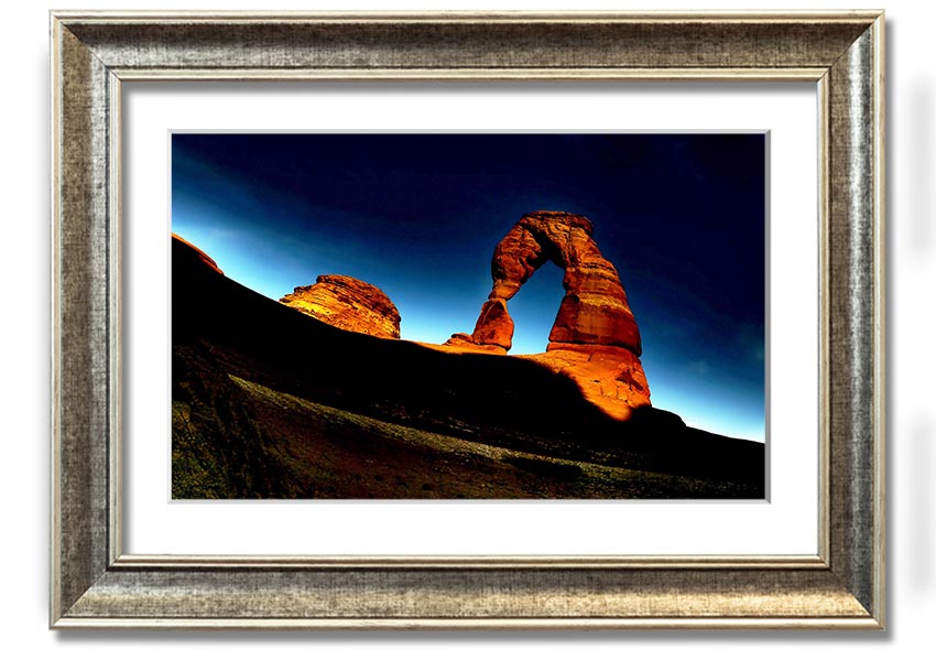 Framed print of Arch Rock at night, showcasing a starry sky and natural beauty, available in various frame colors.