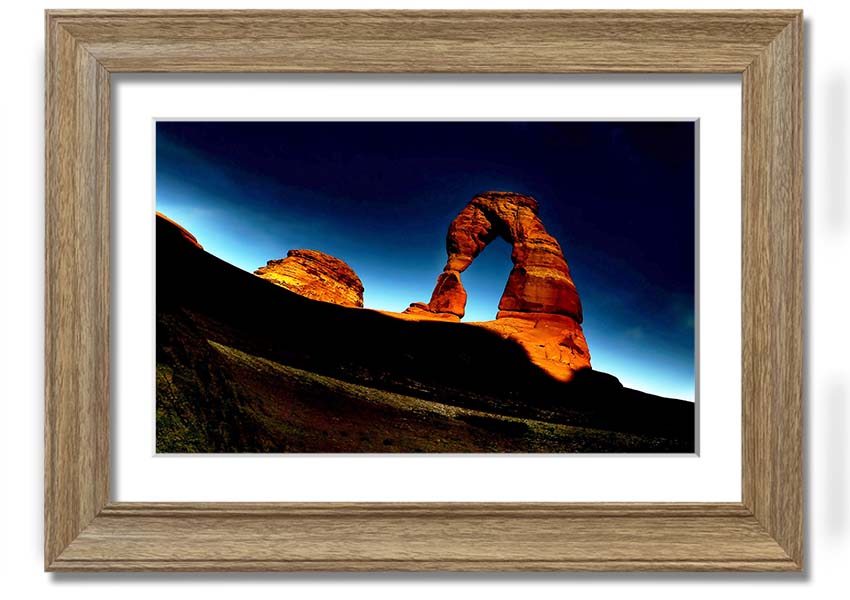 Framed print of Arch Rock at night, showcasing a starry sky and natural beauty, available in various frame colors.