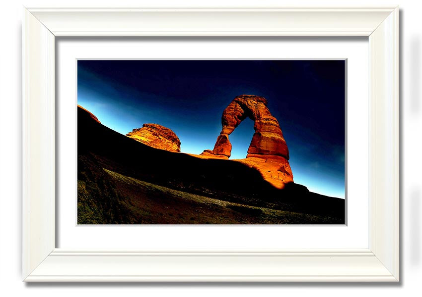 Framed print of Arch Rock at night, showcasing a starry sky and natural beauty, available in various frame colors.