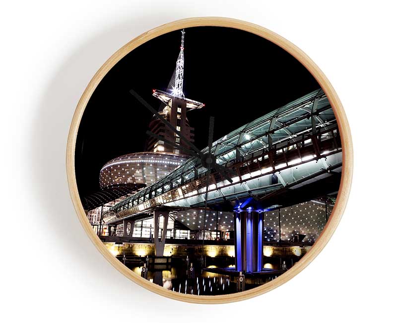 Architects Walkway clock made from natural bamboo with a round face and clear Plexiglas lens, available in black, white, and natural frame colors.