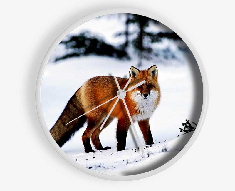 A stylish clock featuring an Arctic fox in a snowy landscape, crafted from natural bamboo with a clear Plexiglas lens.