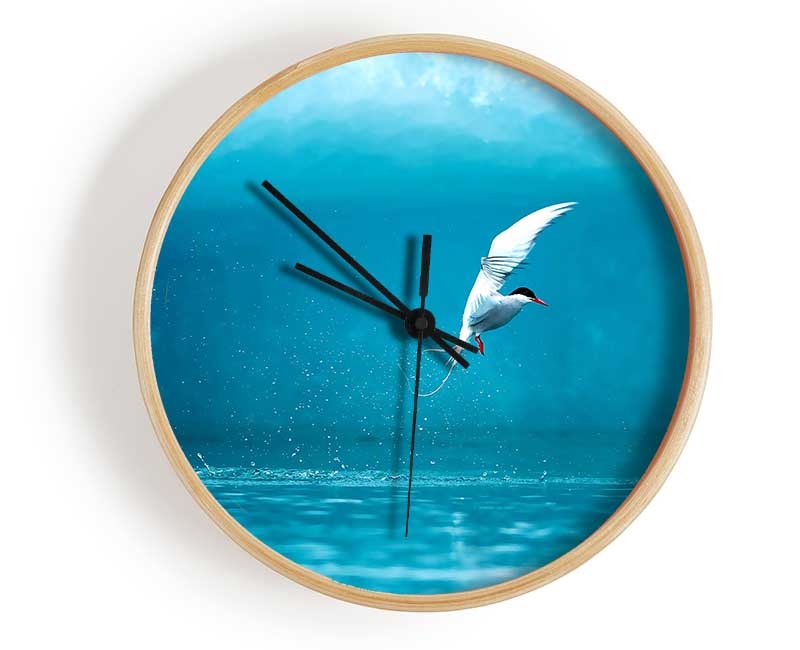 Arctic Tern bamboo clock with a round face, available in black, white, and natural frame colors, featuring a clear Plexiglas lens.