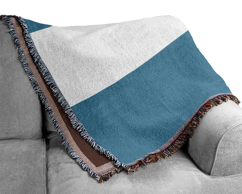 Luxurious Argentina 1 cotton throw blanket in a cozy setting, showcasing its thermal weave and elegant design.