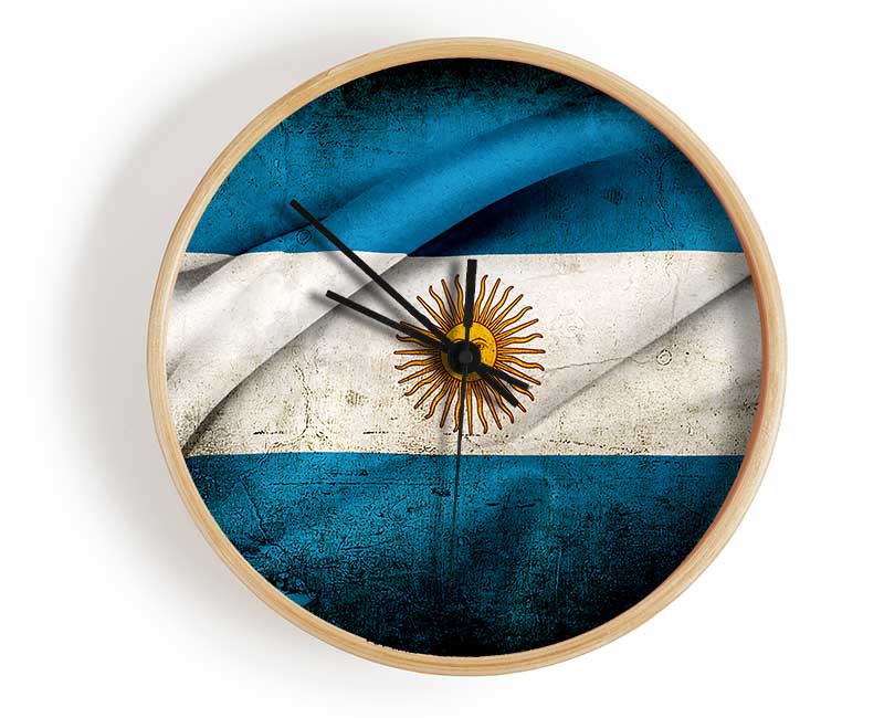 Argentina Sun Flag clock made from natural bamboo with a round face and clear Plexiglas lens, available in multiple colors.