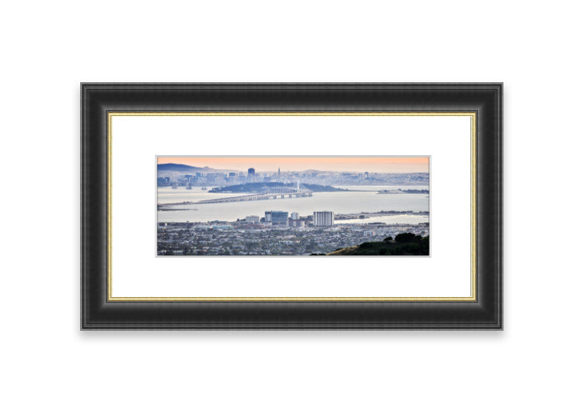 A framed print showcasing an aerial view of a vibrant city, beautifully presented in a stylish frame.