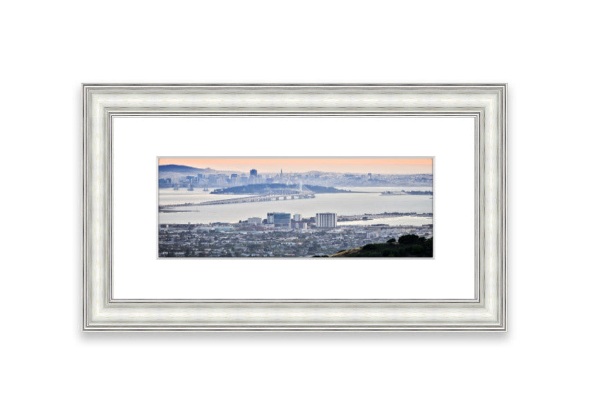 A framed print showcasing an aerial view of a vibrant city, beautifully presented in a stylish frame.