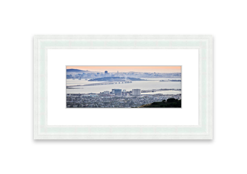 A framed print showcasing an aerial view of a vibrant city, beautifully presented in a stylish frame.