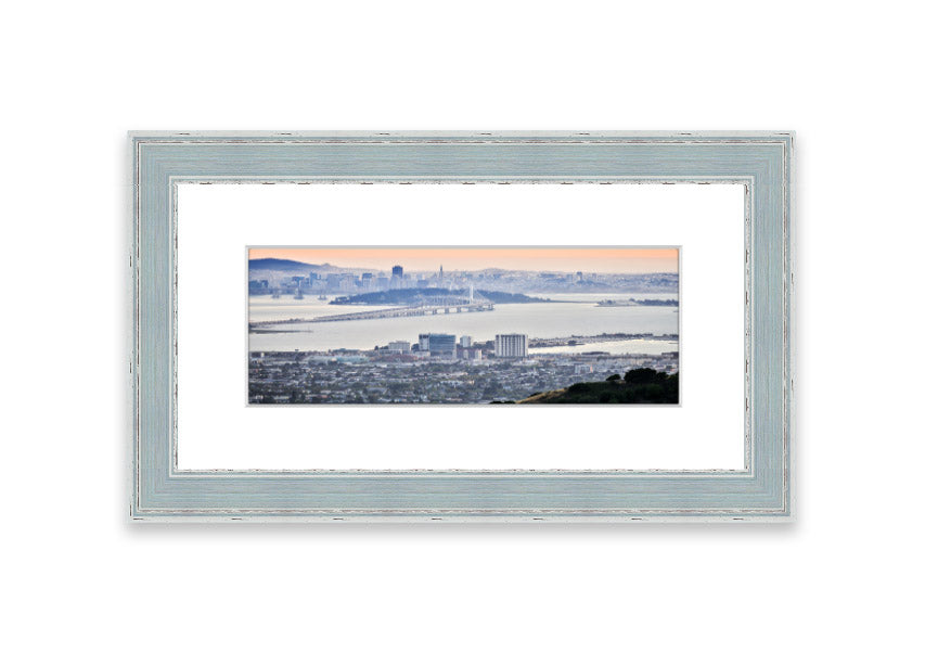 A framed print showcasing an aerial view of a vibrant city, beautifully presented in a stylish frame.