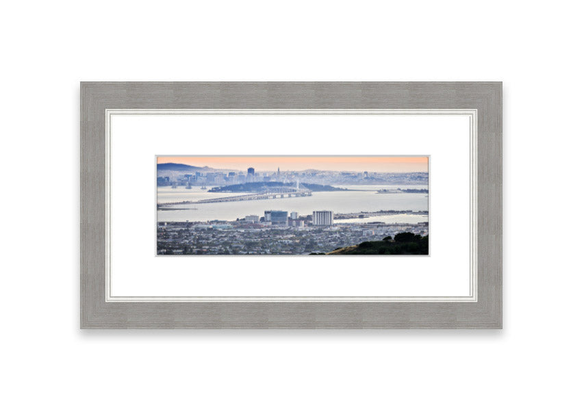 A framed print showcasing an aerial view of a vibrant city, beautifully presented in a stylish frame.