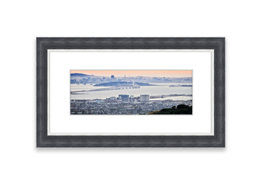 A framed print showcasing an aerial view of a vibrant city, beautifully presented in a stylish frame.