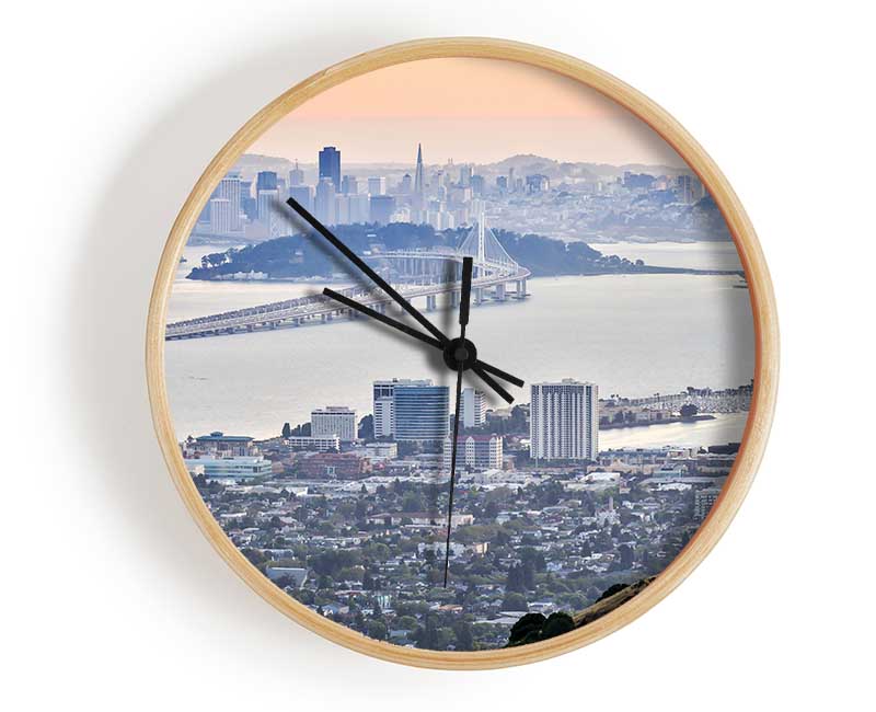 A stylish bamboo clock with a round face, available in black, white, and natural colors, featuring a clear Plexiglas lens.