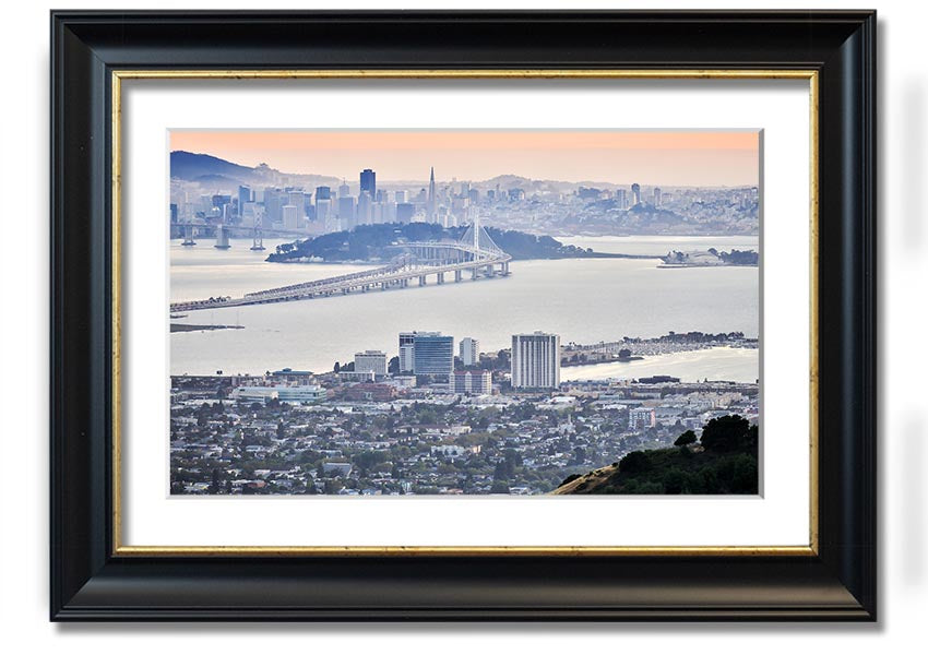 A framed print showcasing an aerial view of a vibrant city, available in various frame colors, ready to hang.