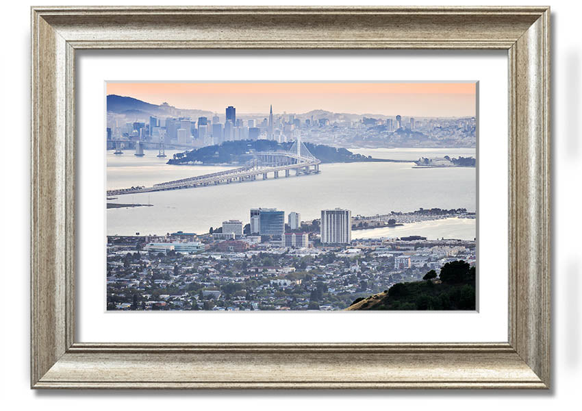 A framed print showcasing an aerial view of a vibrant city, available in various frame colors, ready to hang.