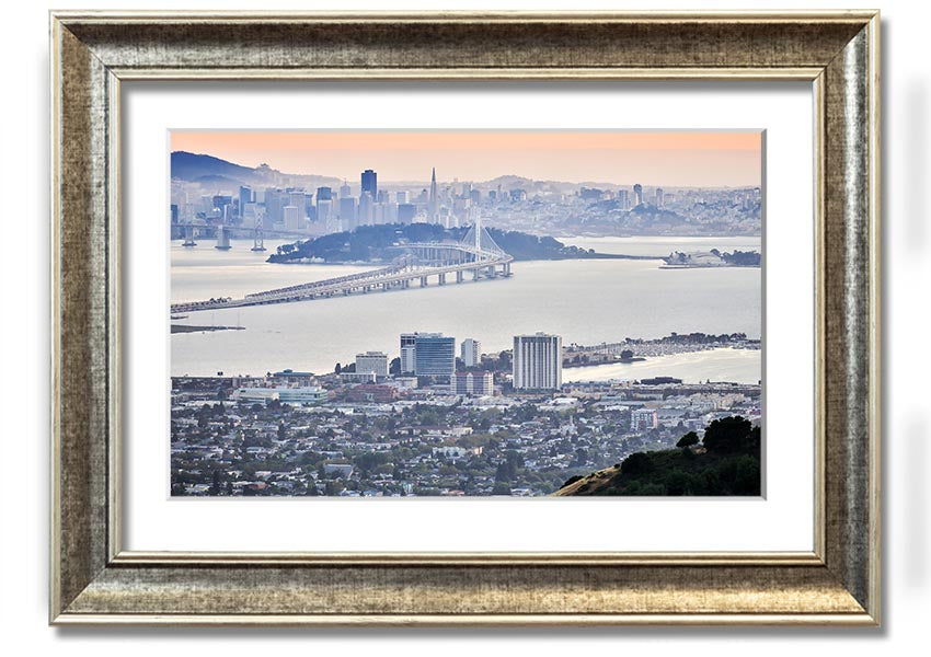 A framed print showcasing an aerial view of a vibrant city, available in various frame colors, ready to hang.