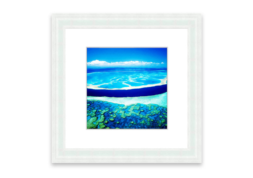 A framed print showcasing an aerial view of a turquoise ocean, beautifully capturing the vibrant colors and serene waves.