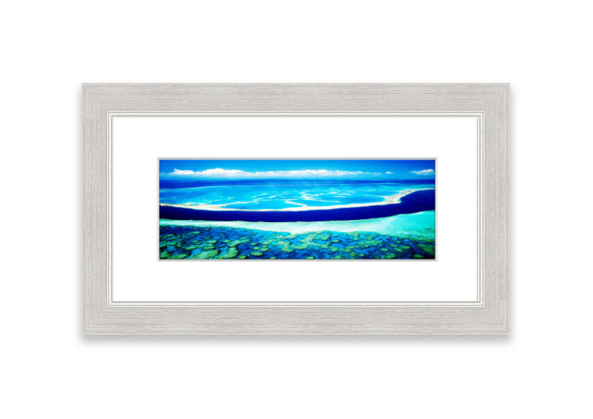 A framed print showcasing an aerial view of a turquoise ocean, beautifully capturing the vibrant colors and serene waves.