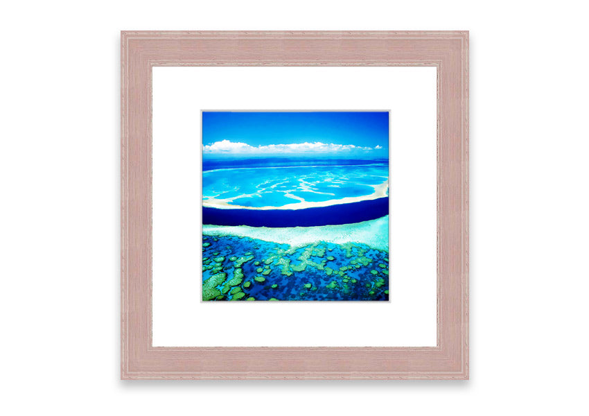 A framed print showcasing an aerial view of a turquoise ocean, beautifully capturing the vibrant colors and serene waves.