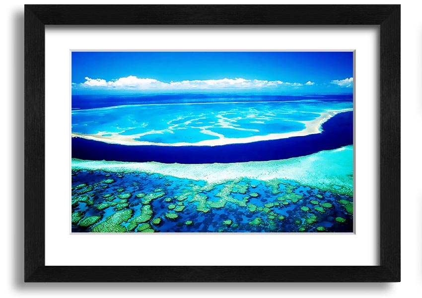 A framed print showcasing an aerial view of a turquoise ocean, highlighting vibrant blue waters and intricate patterns.