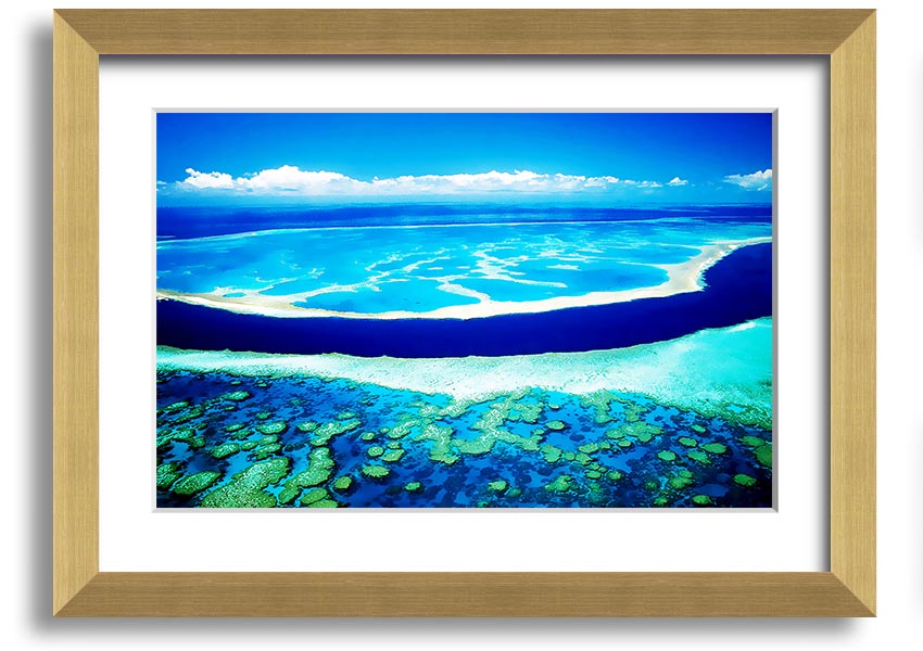 A framed print showcasing an aerial view of a turquoise ocean, highlighting vibrant blue waters and intricate patterns.