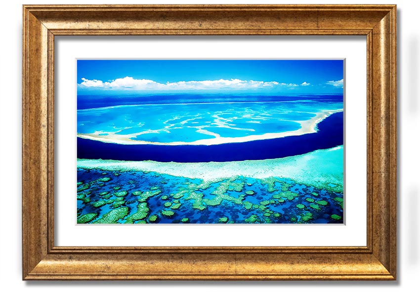 A framed print showcasing an aerial view of a turquoise ocean, highlighting vibrant blue waters and intricate patterns.