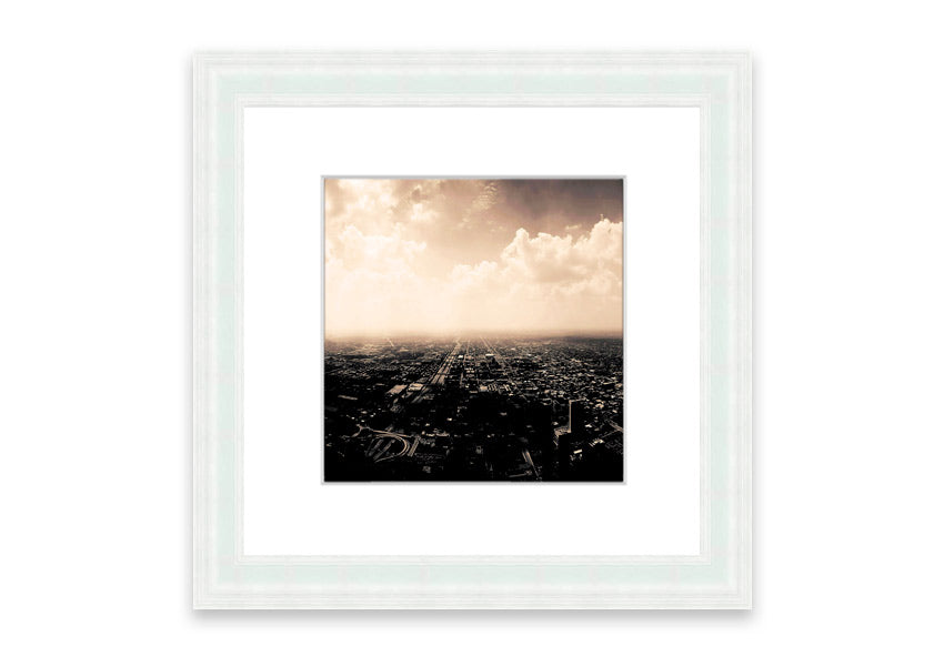 A framed print of an aerial view over a vibrant city, showcasing intricate details and colors, ready to hang on a wall.