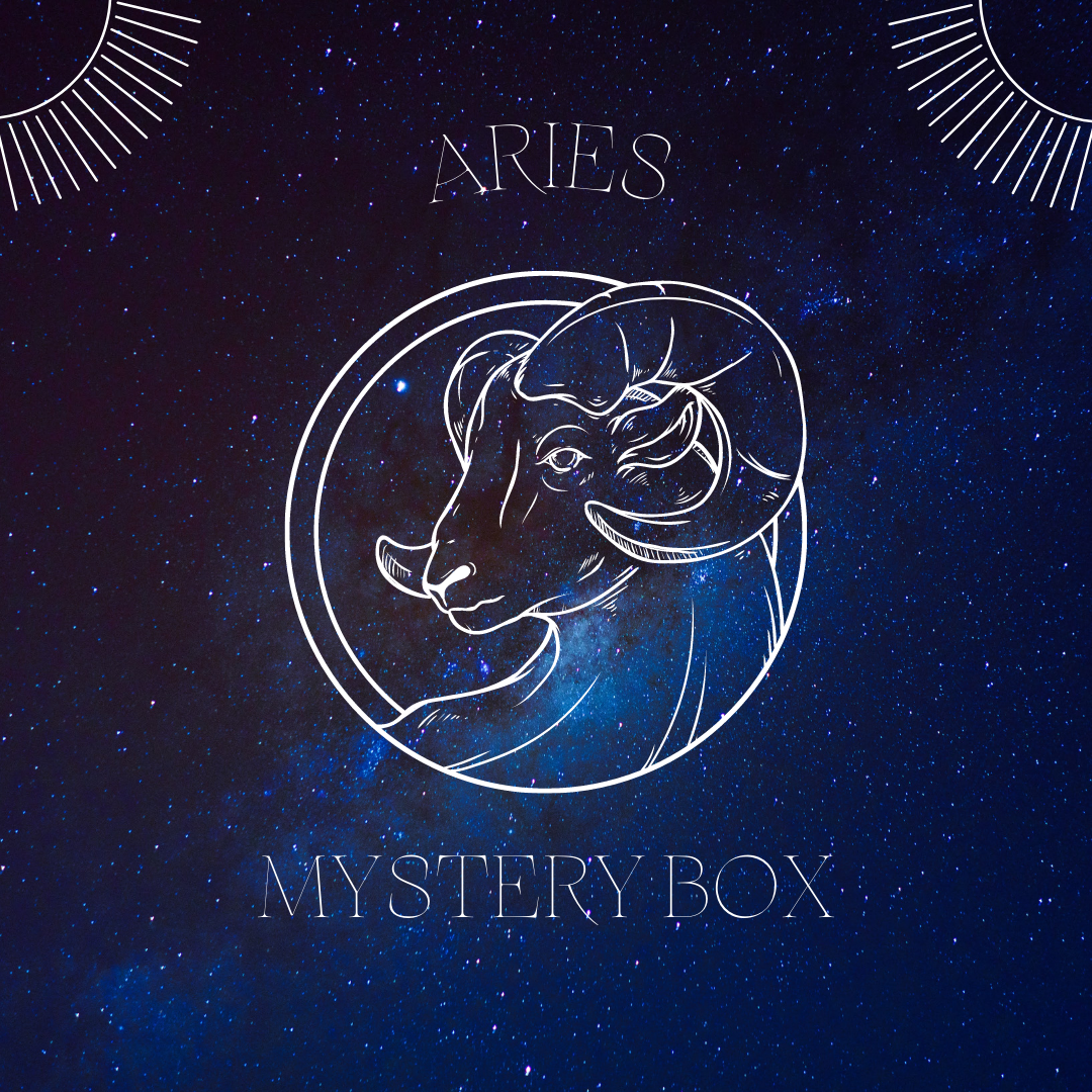 Aries Mystery Box featuring assorted crystals, sage, and candles, beautifully arranged for astrological energy balance.