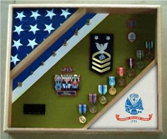 A beautifully crafted Army shadow box displaying military memorabilia, featuring a US Army flag and medals in a customizable wooden frame.