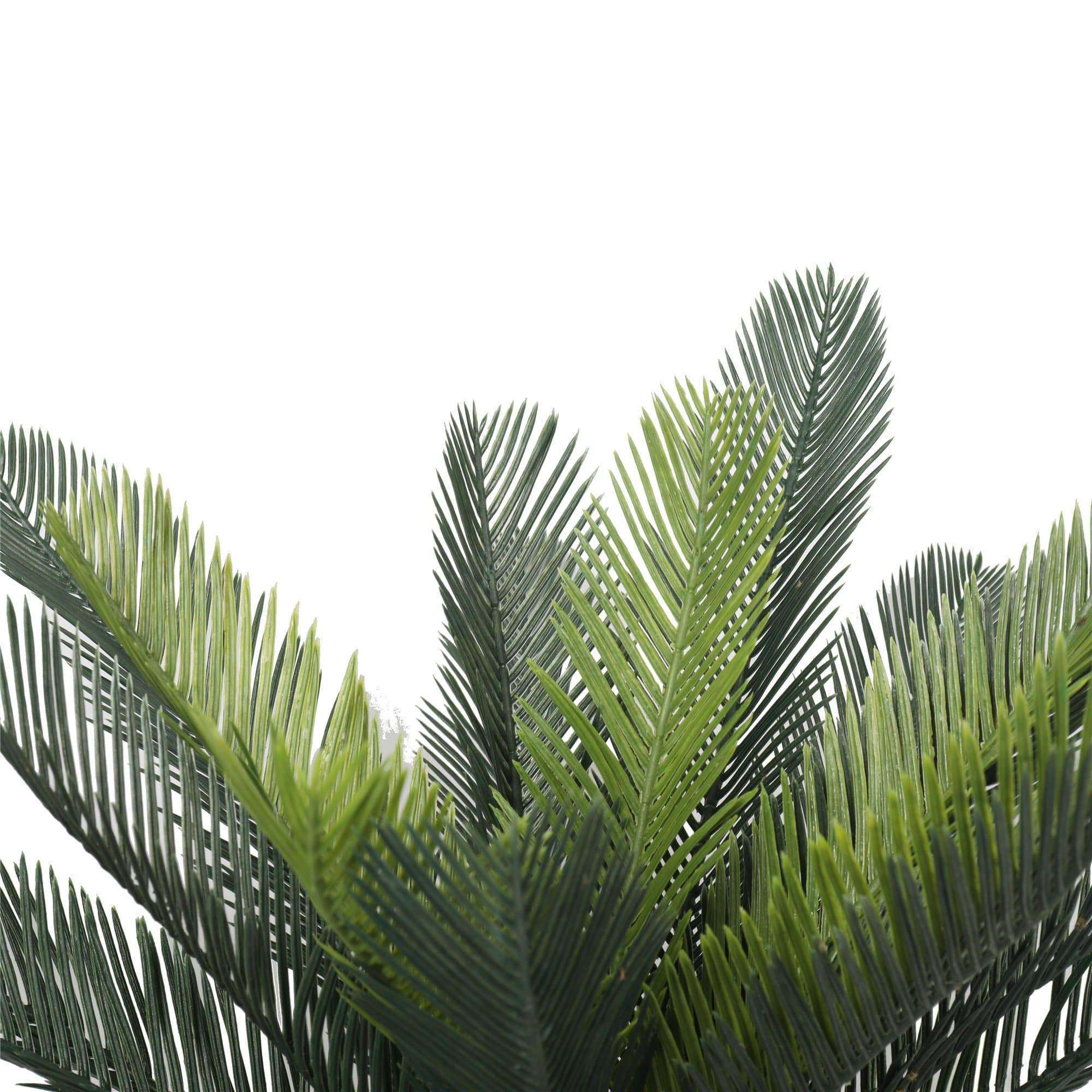 A realistic 60cm Artificial Cycad Plant in a small pot, showcasing mixed greens and browns, perfect for indoor decoration.