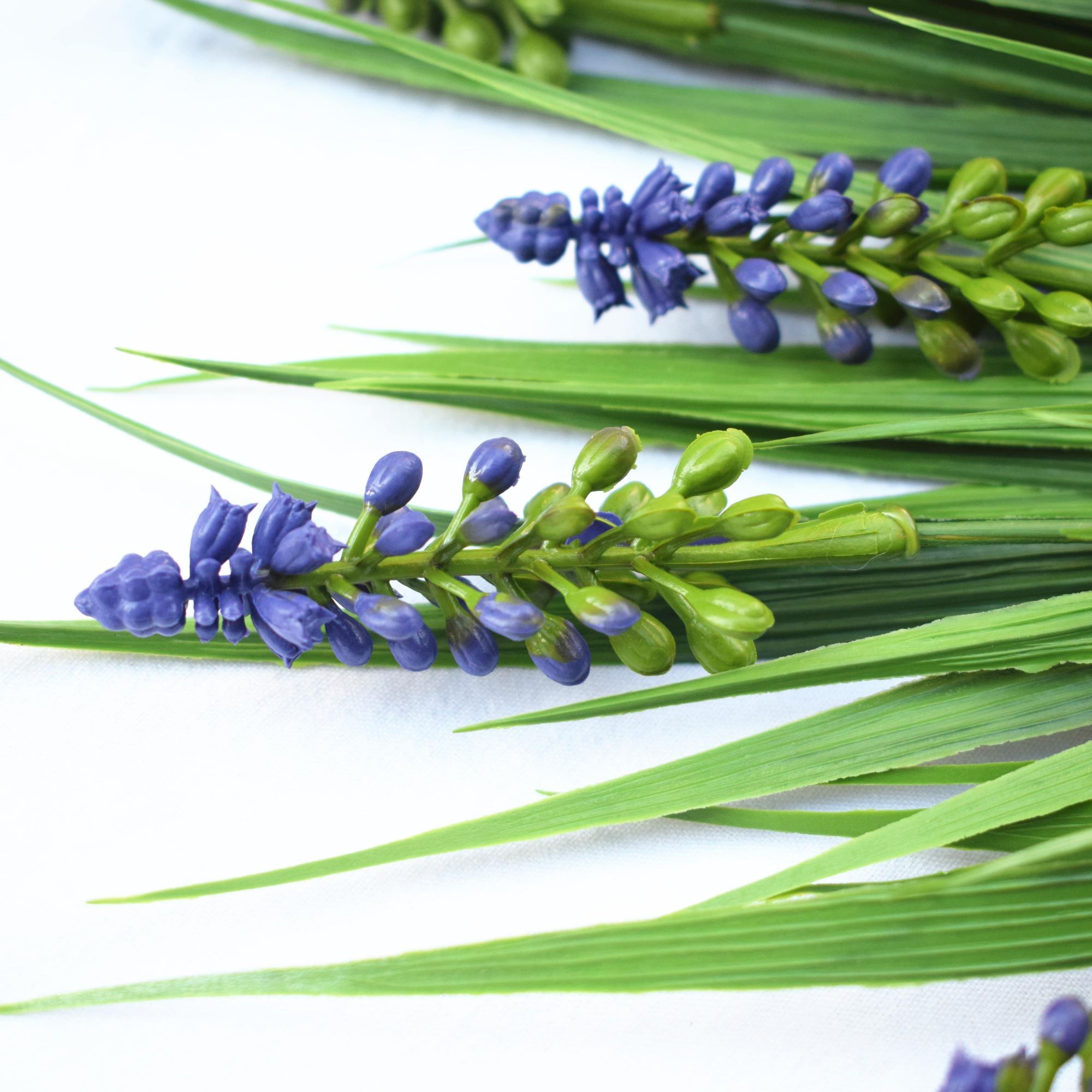 Artificial Dense English Lavender Stem, 50cm long with vibrant lavender flowers and lush green foliage, perfect for decor and arrangements.