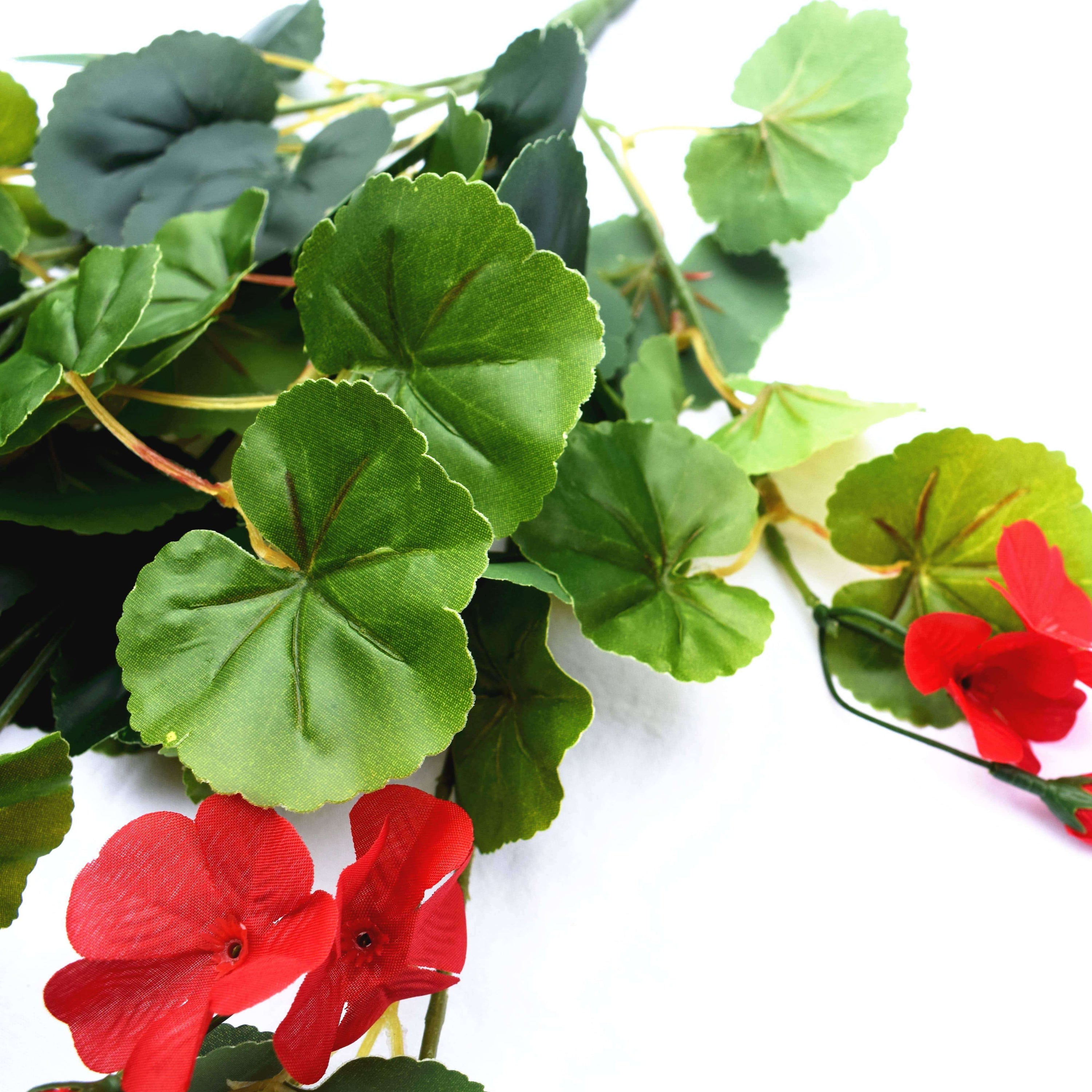 A 60cm artificial geranium hanging bush featuring vibrant red flowers and lush green leaves, perfect for indoor and outdoor decoration.