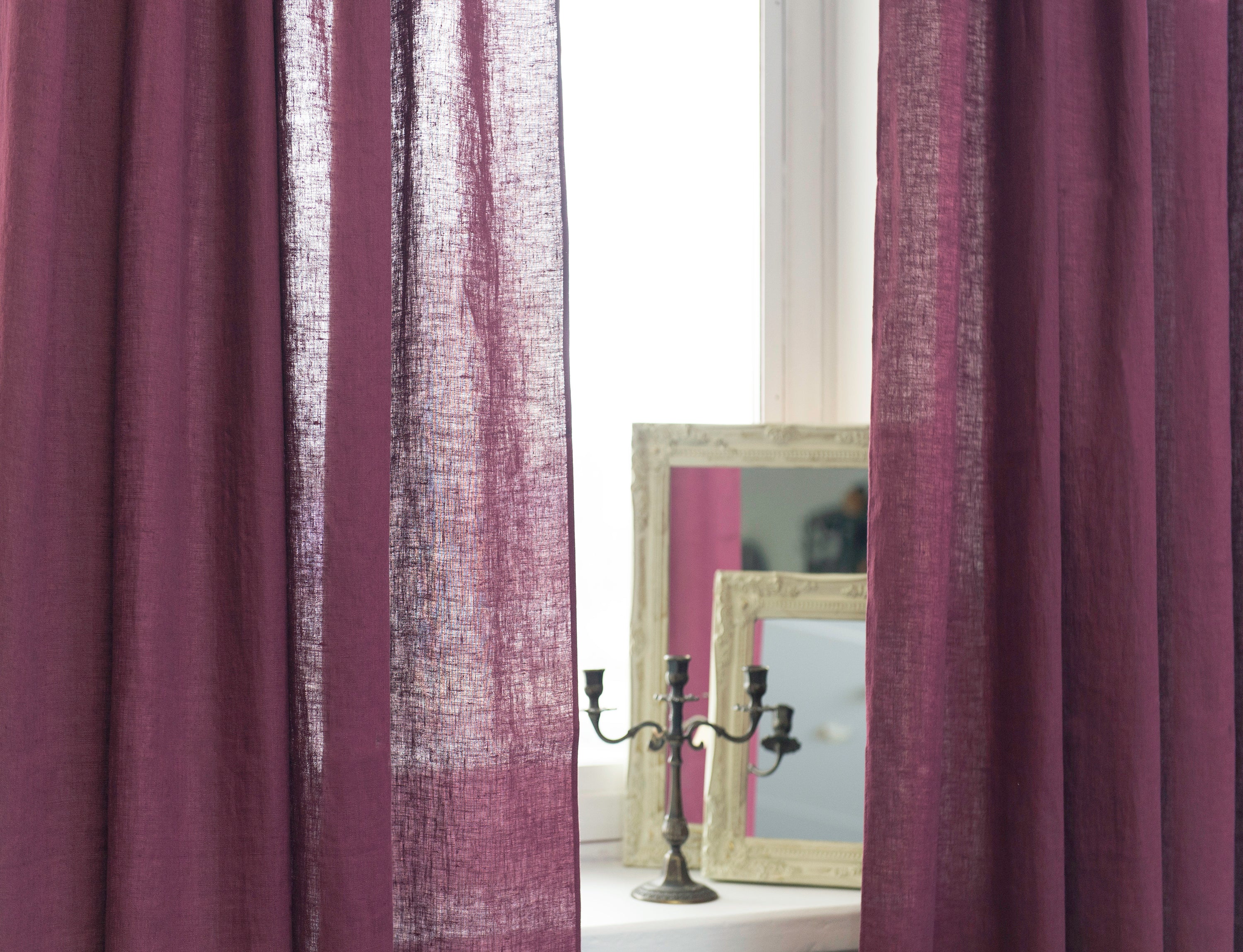 Asphalt Grey linen curtain with tab tops, elegantly draping and semi-sheer, showcasing its texture and color.